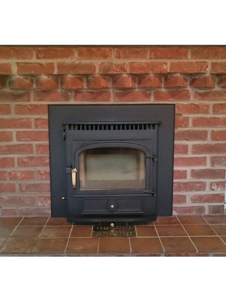 vision inset in brick fireplace with 4 inch trim