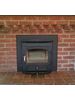 vision inset in brick fireplace with 4 inch trim