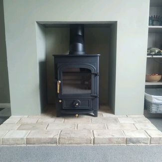 Clearview Pioneer 400 5Kw multi-fuel stove on 2 inch legs installed in Norwich