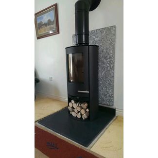Termatech TT20R 5kw woodburner attached to a twin wall flue with a VLAZE heat shield panel behind
