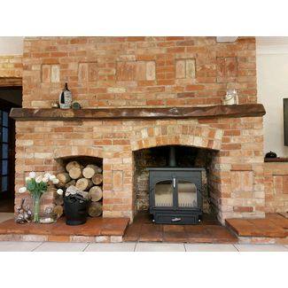Clearview 650 flat top in black with satin chrome fittings 12kw stove in a brick fireplace