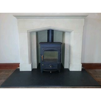 Clearview Pioneer 400 on 2 legs in black with brass fittings. Corinthian stone Swinford mantel & Honed granite hearth