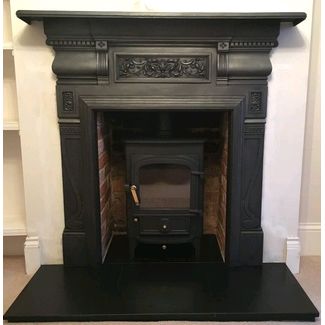Clearview Pioneer 400 on 4 inch legs in black with brass fittings 5kw multi-fuel stove in a cast iron mantel 
