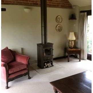 Clearview Solution 400 in honey glow brown with matching twin wall flue painted brown