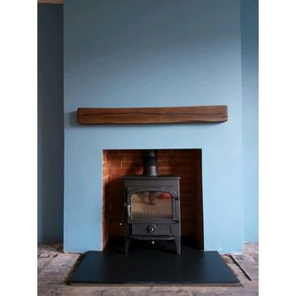 Clearview Vision 500 on 6 inch legs with satin chrome fittings and a 48 Geocast dark oak effect beam from Capital fireplaces