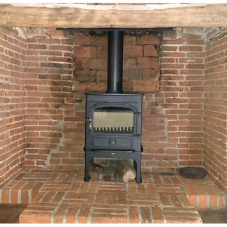Clearview Vision 500 on a 300mm tall logstore 8kw multifuel stove