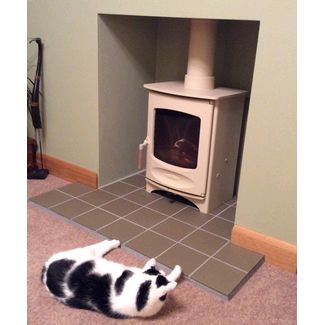 Cream paimted woodburner with green tiled hearth