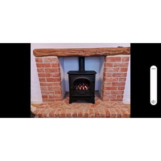 Gazco Stockton 5 gas stove coal effect with a brick fireplace and beam we built