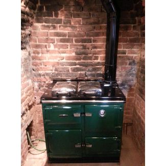 We supplied and installed this green enamel rayburn cooker for central heating