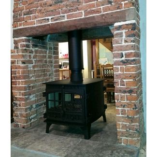 Hunter Herald 14 double sided multifuel stove in a double sided brick fireplace