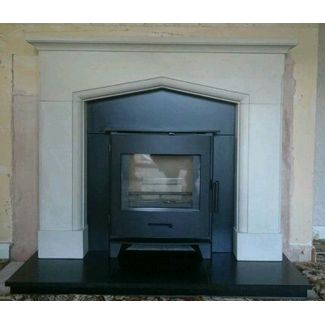 Pevex Newbourne inset multifuel stove in a Swinford limestone mantel and honed granite back panel and hearth