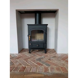 Clearview Pioneer 400 on 4 inch legs with a brick herringbone hearth