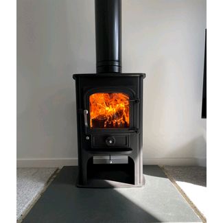 Clearview Solution 400 with satin chrome fittings 5kw multifuel convection stove on a log store