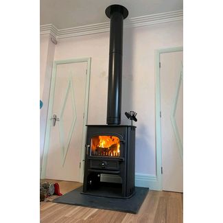 Clearview Solution 500 multifuel stove on a log store 8kw convection stove fitted with a twin wall flue