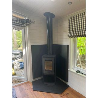 Di Lusso Euro R4 woodburner with Duoten metal painted heat shields and a clipped corner honed granite hearth