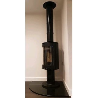 Jotul Woodburner tall contemporary convection stove on a pedestal 