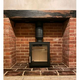 Parkray Aspect 5 woodburner with brick fireplace and pamment hearth we built and oak beam