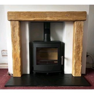 Pevex Newbourne 40 FS direct air woodburner 5kw with a Focus Fireplace Beamish in Pale Oak effect