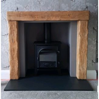Stovax Stockton 5 with a non combustible pale oak effect beamish from Focus Fireplaces