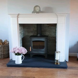 Capital fireplaces Balham mantel in Aegean limestone with a split face tiled recess and honed granite hearth