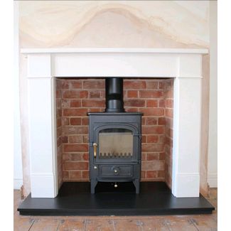 Clearview Pioneer 400 on 4 inch legs with a Hersham Aegean limestone mantel and brick lined recess we built ourselves