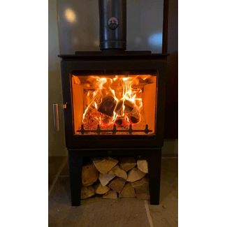 Town and Country Fires Pickering on a log store 